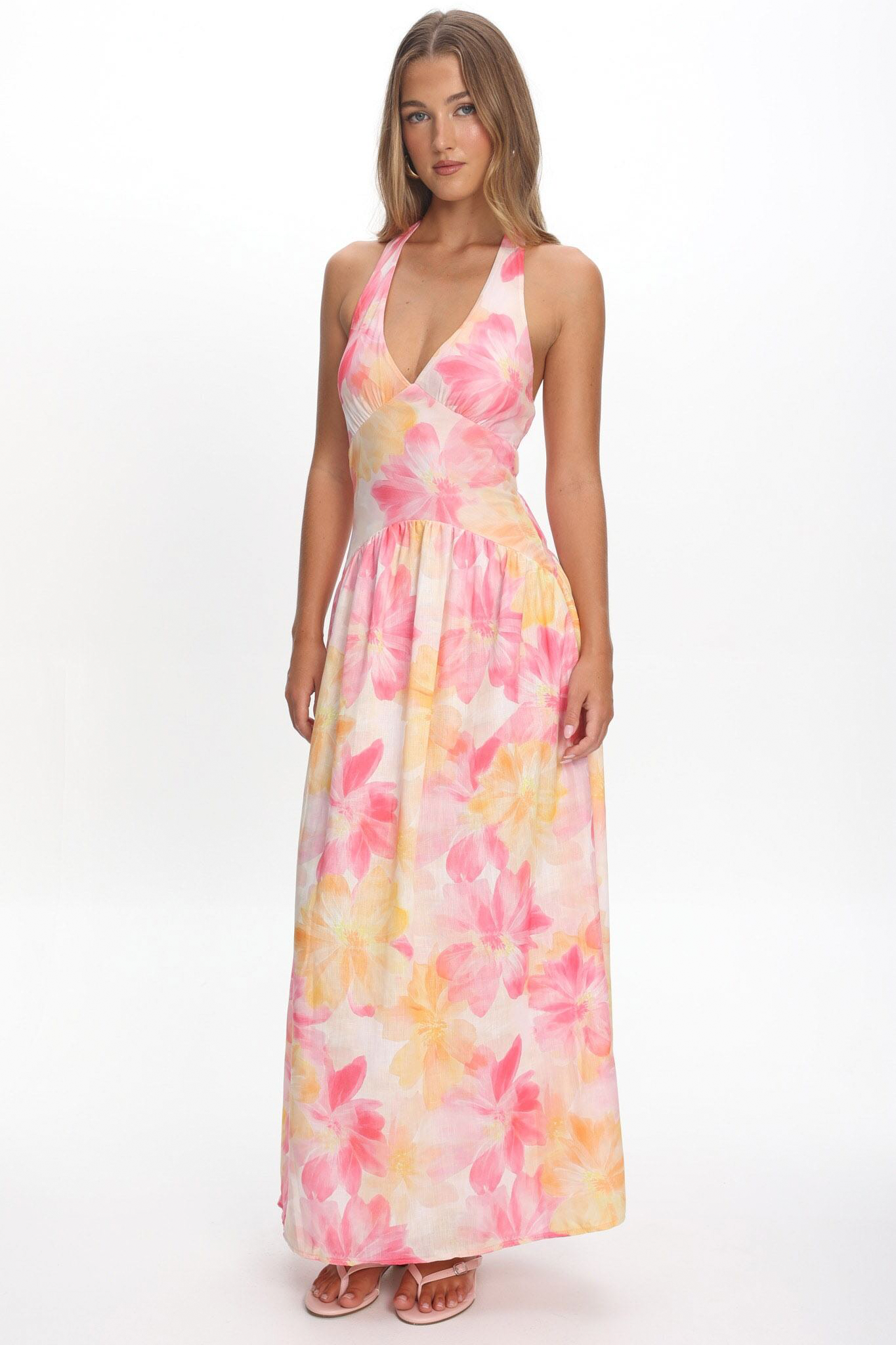 Lady stood by fireplace wearing black maxi dress