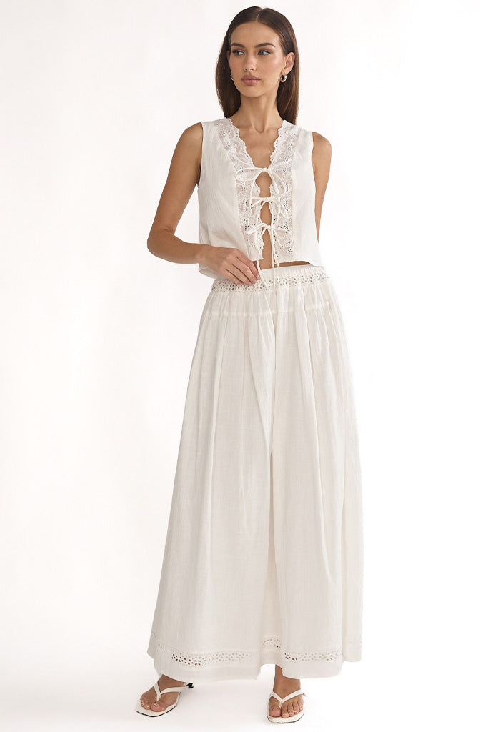 Girl wearing brown top and skirt set