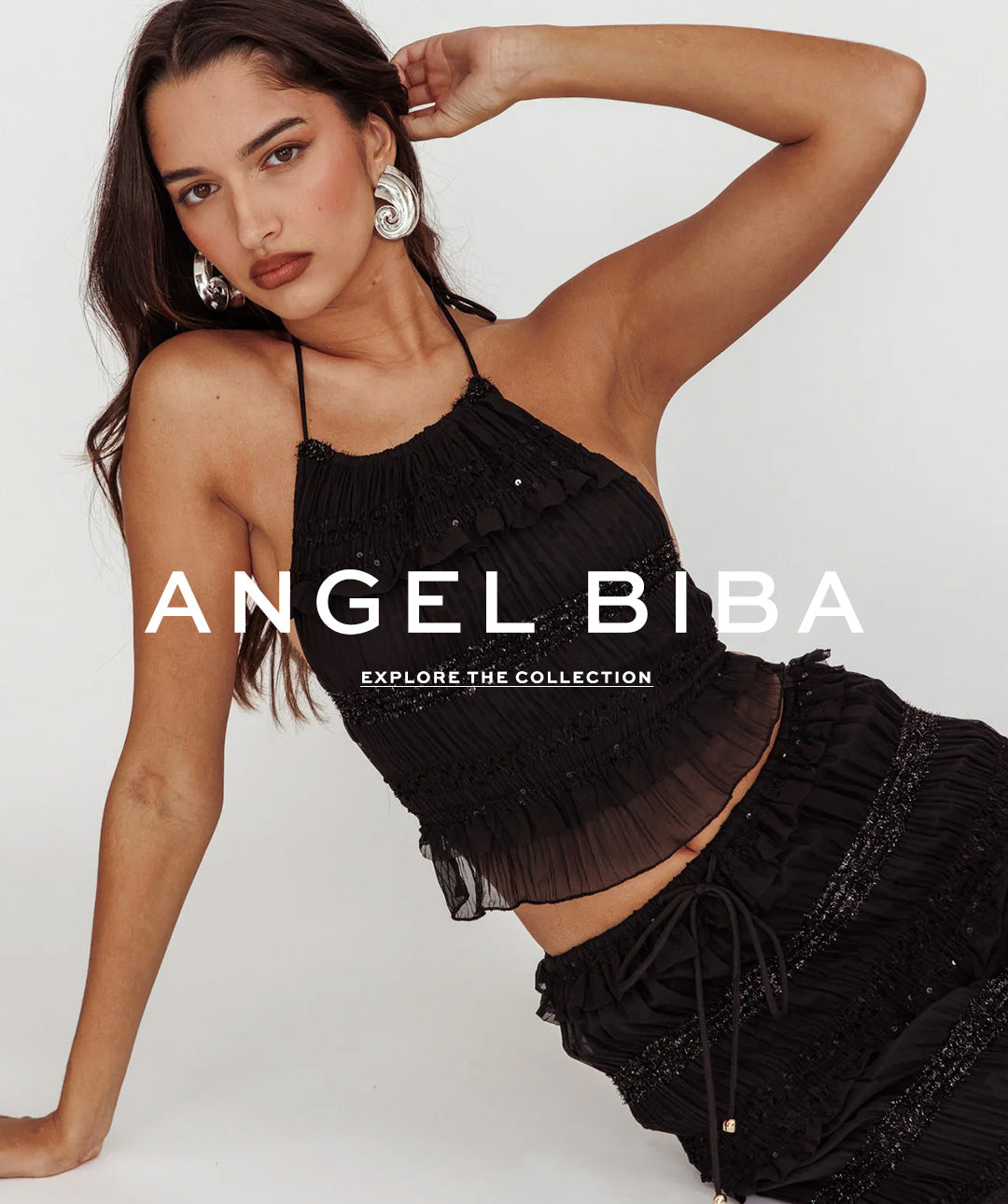 Angel Biba model wearing black top and black skirt