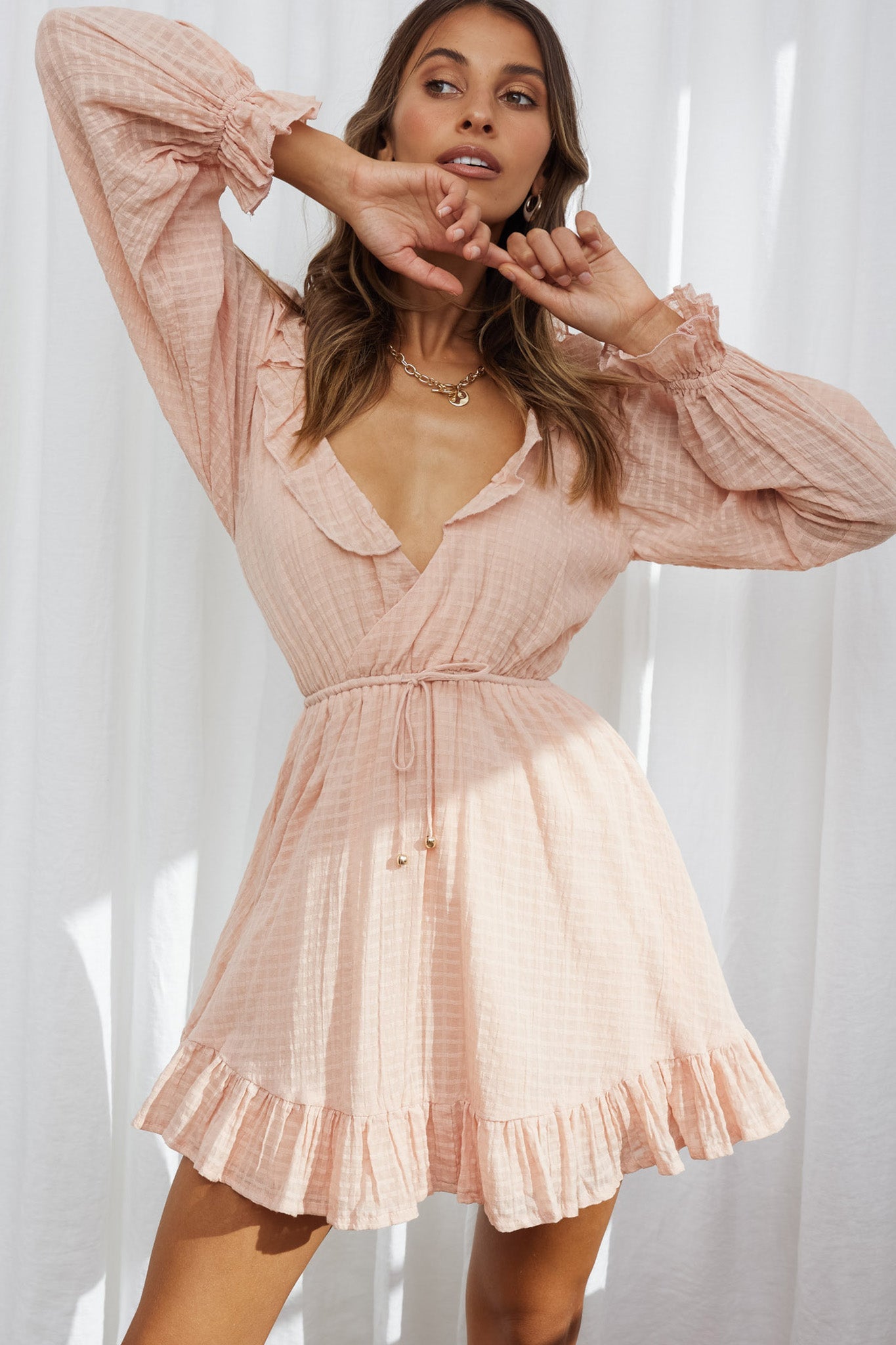Hooked On A Feeling Long Sleeve String Tie Back Mini Dress Peach by Selfie Leslie